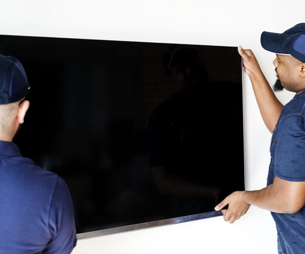 handyman mounting TV